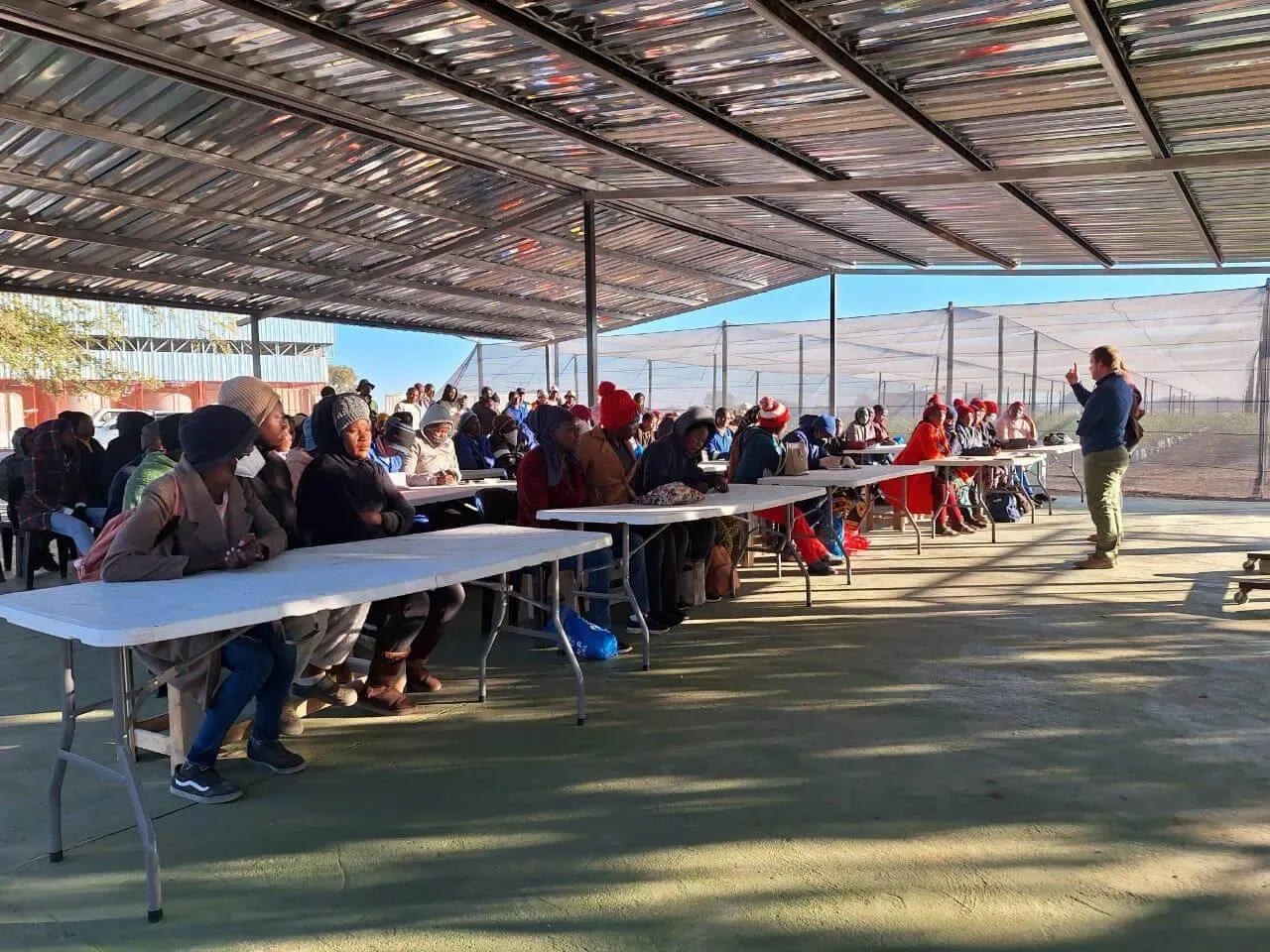 Namibia Berries team members at a training session under the shade roof of the Green Area